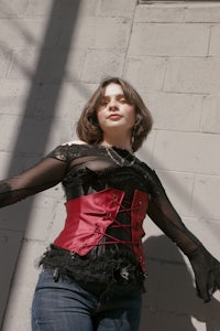 a woman wearing a red corset