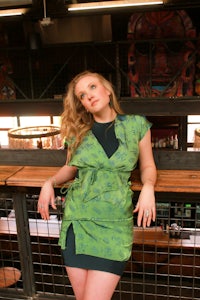 a woman wearing a green dress