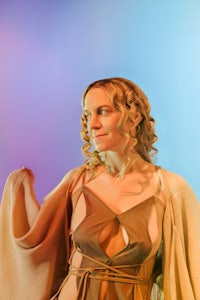 a woman in a tan dress